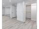 Finished basement with mirrored wall, and multiple walk in closets at 17 E Belleview Ln, Greenwood Village, CO 80121