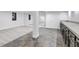 Finished basement with tile and laminate flooring, kitchenette and mirrored wall at 17 E Belleview Ln, Greenwood Village, CO 80121