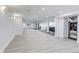 Large finished basement offers versatile living space with mirrored wall and kitchenette at 17 E Belleview Ln, Greenwood Village, CO 80121