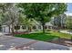 Well-maintained home with beautiful landscaping, mature trees, and a spacious driveway at 17 E Belleview Ln, Greenwood Village, CO 80121