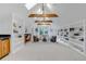 Bright living room with vaulted ceilings, skylights, and built-in shelving at 17 E Belleview Ln, Greenwood Village, CO 80121
