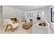 Bright living room features a brick fireplace, wood floors, and stylish furniture at 17 E Belleview Ln, Greenwood Village, CO 80121
