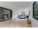 Spacious main bedroom featuring modern fireplace, hardwood floors, and ample natural light at 17 E Belleview Ln, Greenwood Village, CO 80121