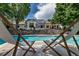 Relaxing poolside view with lounge chairs overlooking the sparkling pool and well-manicured backyard at 17 E Belleview Ln, Greenwood Village, CO 80121