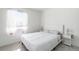 Clean, minimalist bedroom with white walls, and a comfortable bed at 20604 E 38Th Pl, Denver, CO 80249