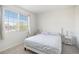 Cozy bedroom with a view featuring carpeted floors, neutral walls, and natural light at 20604 E 38Th Pl, Denver, CO 80249