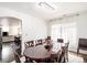 Bright dining room with a chandelier, large table, and plenty of natural light at 20604 E 38Th Pl, Denver, CO 80249