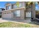 Inviting front entrance with brick facade, double doors, and attached two-car garage at 20604 E 38Th Pl, Denver, CO 80249
