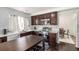 Well-equipped kitchen with stainless steel appliances, tile backsplash, and custom cabinets at 20604 E 38Th Pl, Denver, CO 80249
