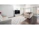 Spacious living room featuring neutral furniture, decorative rug, and sliding glass door at 20604 E 38Th Pl, Denver, CO 80249