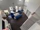 Spacious living area featuring high ceilings, fireplace, and comfortable blue seating at 20604 E 38Th Pl, Denver, CO 80249
