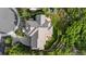 Aerial view of landscaped home showing stone patio with firepit and lush wooded surroundings at 4788 Silver Pine Dr, Castle Rock, CO 80108