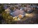 Stunning aerial view of a home with a cozy outdoor fireplace and a beautifully landscaped yard in a desirable neighborhood at 4788 Silver Pine Dr, Castle Rock, CO 80108