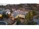 An aerial view of the beautiful home in a hillside community with mature trees at 4788 Silver Pine Dr, Castle Rock, CO 80108