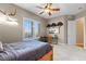 Bright bedroom with a desk, ceiling fan and great natural light from the large window at 4788 Silver Pine Dr, Castle Rock, CO 80108