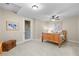 Spacious bedroom with a wood-frame bed and a door leading to an outdoor space at 4788 Silver Pine Dr, Castle Rock, CO 80108