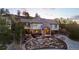 Stunning two-story home with stone landscaping and a charming covered front porch at 4788 Silver Pine Dr, Castle Rock, CO 80108
