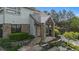 Inviting entryway showcasing a custom wood door, stone accents, and professionally landscaped front yard at 4788 Silver Pine Dr, Castle Rock, CO 80108