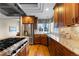 A kitchen featuring stainless appliances, wooden cabinets, and a large window at 4788 Silver Pine Dr, Castle Rock, CO 80108