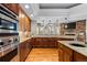 A beautifully designed kitchen features wooden cabinets and stainless steel appliances at 4788 Silver Pine Dr, Castle Rock, CO 80108