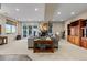 Spacious living area with a fireplace, plush seating, and large windows at 4788 Silver Pine Dr, Castle Rock, CO 80108