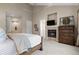 Comfortable main bedroom featuring a fireplace, neutral decor, and an inviting atmosphere for relaxation at 4788 Silver Pine Dr, Castle Rock, CO 80108