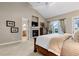 Spacious main bedroom with a cozy fireplace, soft lighting, and a tranquil ambiance for restful nights at 4788 Silver Pine Dr, Castle Rock, CO 80108