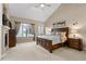 Serene main bedroom retreat boasts a spacious layout, large windows, neutral tones, and abundant natural light at 4788 Silver Pine Dr, Castle Rock, CO 80108