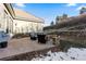 Stone patio with a fire pit and outdoor seating, perfect for entertaining or relaxing outdoors at 4788 Silver Pine Dr, Castle Rock, CO 80108