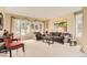 Inviting living room featuring a bay window, plush seating, and neutral tones at 6340 Ashburn Ln, Highlands Ranch, CO 80130