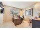 Home office offers a quiet workspace with a large window and neutral decor at 6340 Ashburn Ln, Highlands Ranch, CO 80130