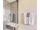 Bathroom features a shower with a glass enclosure, built-in seat, and modern fixtures at 6340 Ashburn Ln, Highlands Ranch, CO 80130