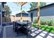 Lovely backyard patio features stylish outdoor dining and a decorative wood pergola with string lights at 3149 W 35Th Ave, Denver, CO 80211