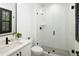 Modern bathroom features a glass-enclosed shower, sleek fixtures, and a stylish vanity with a vessel sink at 3149 W 35Th Ave, Denver, CO 80211