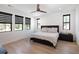 Bright bedroom with a comfortable bed, modern light fixtures, and large windows at 3149 W 35Th Ave, Denver, CO 80211