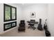 Bright bedroom featuring a chair, keyboard, electric guitar, and black-trimmed window with black louvered blinds at 3149 W 35Th Ave, Denver, CO 80211