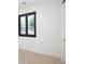 Bedroom featuring a window with black-trimmed window with louvered blinds and cream walls at 3149 W 35Th Ave, Denver, CO 80211