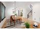 Dining room featuring wood table, stylish lighting fixture, and access to the staircase at 3149 W 35Th Ave, Denver, CO 80211