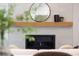 Close up of a modern gas fireplace with a decorative mantle and tiled surround at 3149 W 35Th Ave, Denver, CO 80211