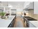 Modern kitchen with large island, stainless steel appliances, and stylish countertops at 3149 W 35Th Ave, Denver, CO 80211