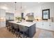 Bright, spacious kitchen featuring a large island with seating and stainless steel appliances at 3149 W 35Th Ave, Denver, CO 80211
