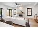Bright living room with a modern fireplace, large windows, and a comfortable white sofa at 3149 W 35Th Ave, Denver, CO 80211