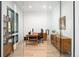 Bright home office featuring glass walls, sleek furniture, and ample natural light at 3149 W 35Th Ave, Denver, CO 80211
