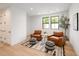 Cozy sitting area with comfortable armchairs, stylish decor, and ample natural light at 3149 W 35Th Ave, Denver, CO 80211