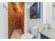 Well-lit bathroom features wood paneled shower at 3300 W 2Nd Ave, Denver, CO 80219
