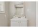 Bathroom features a vanity with a mirror, modern fixtures, and ample storage at 3300 W 2Nd Ave, Denver, CO 80219