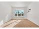 Bright bedroom with large window, neutral walls and soft carpeting at 3300 W 2Nd Ave, Denver, CO 80219