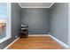 Bedroom with wood laminate floors, neutral decor, and natural light at 3300 W 2Nd Ave, Denver, CO 80219