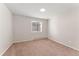 Empty bedroom with window and neutral tones at 3300 W 2Nd Ave, Denver, CO 80219