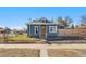 Charming blue home featuring a well-maintained yard and inviting curb appeal at 3300 W 2Nd Ave, Denver, CO 80219